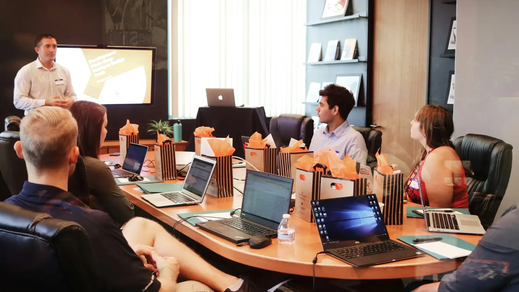 Participants at laptops in a training room during a workshop session