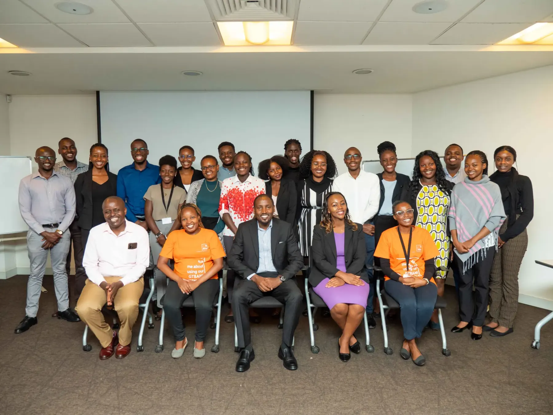 A diverse group of professionals posing together after a training session